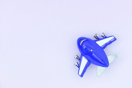 Airplane toy top view, travel concept. Flat lay, copy space