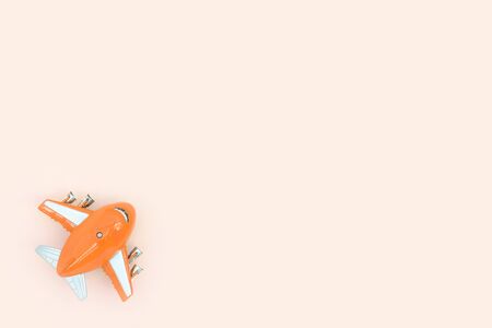 Airplane toy top view, travel concept. Flat lay, copy space