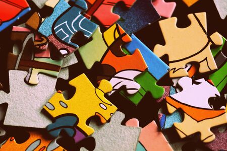 Children's puzzles on a dark background close up. Retro style tonedの写真素材