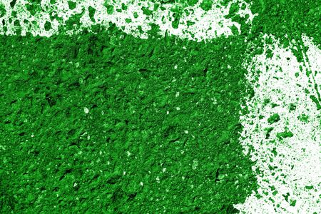Old asphalt surface with white paint close-up, top view. Abstract background. Green color tonedの写真素材