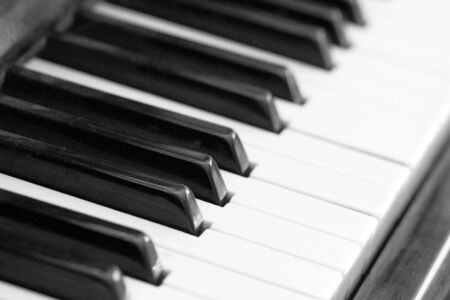 The keys of an old piano close up. Musical background black and whiteの写真素材