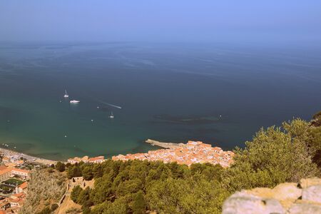 View of Cefalu town from the Rocca di Cefalu in early morning. Sicily, Italy. Retro style tonedの写真素材