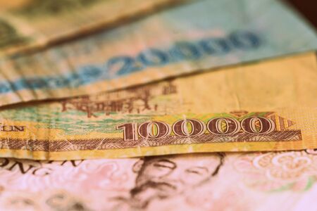 Vietnamese dong closeup on a dark background. Money background retro style tonedの写真素材