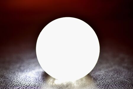 Glowing crystal ball on a dark background. Future reading conceptの写真素材