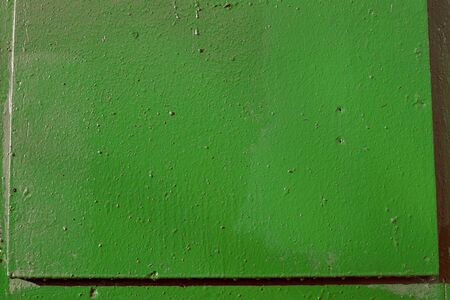 Old painted green door texture close-up. Abstract backgroundの写真素材