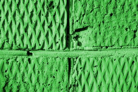 Brick wall texture in sunny day close-up. Abstract background green color tonedの写真素材