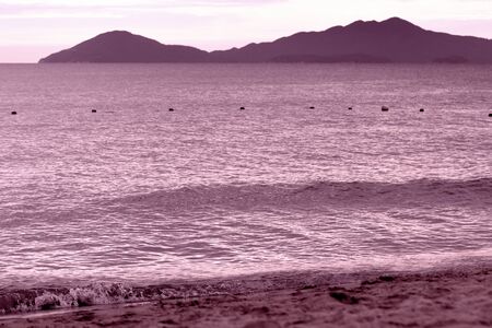 Sea view from the coast of Vietnam in the evening. Seascape pink color toned. Hoi An, Vietnamの写真素材