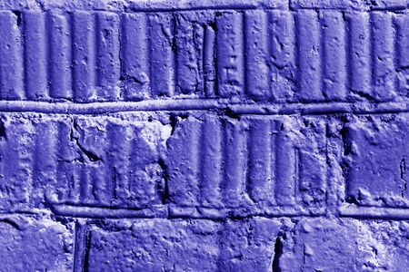 Old painted brick wall close-up. Brick wall background blue color tonedの写真素材