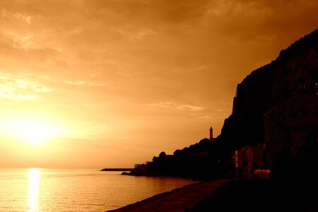 Beautiful sunrise over the sea near the coast of Sicily. Natural background orange color tonedの写真素材