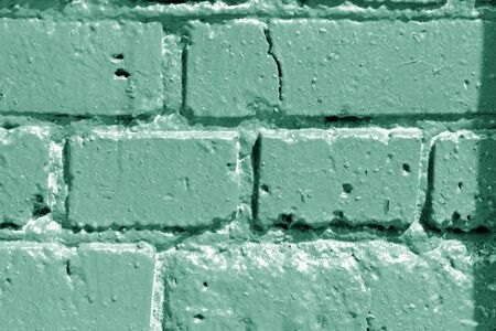 Painted brick wall close up. Abstract background green color tonedの写真素材