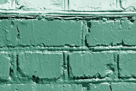 Painted brick wall close up. Abstract background green color tonedの写真素材