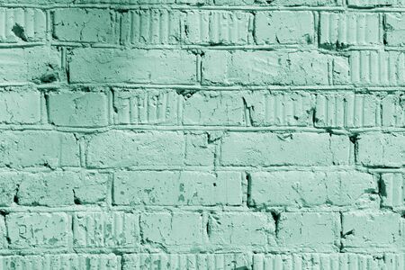 Painted brick wall close up. Abstract background green color tonedの写真素材