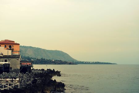 Morning seascape near Cefalu town on the Sicily, Italy.  Natural toned background