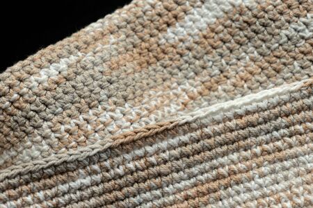 Fragment of crocheted canvas of melange yarn closeup. Abstract backgroundの写真素材