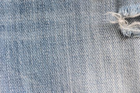 Old blue jeans texture close-up. Denim background. Top viewの写真素材