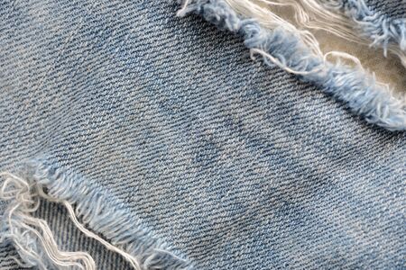 Old blue jeans texture close-up. Denim background. Top viewの写真素材