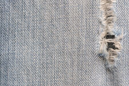 Old blue jeans texture close-up. Denim background. Top viewの写真素材