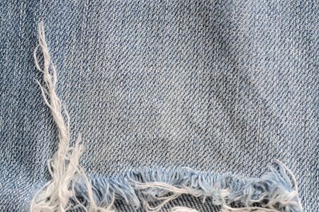 Old blue jeans texture close-up. Denim background. Top viewの写真素材