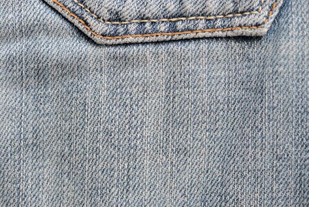 Old blue jeans texture close-up. Denim background. Top viewの写真素材