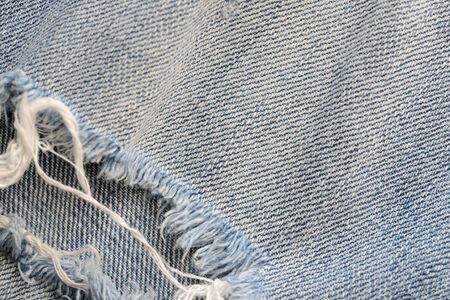 Old blue jeans texture close-up. Denim background. Top viewの写真素材