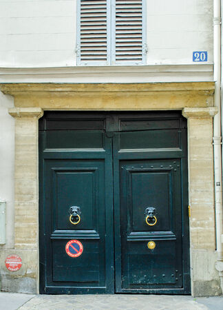 French building entrance beautiful wood door in Parisの写真素材