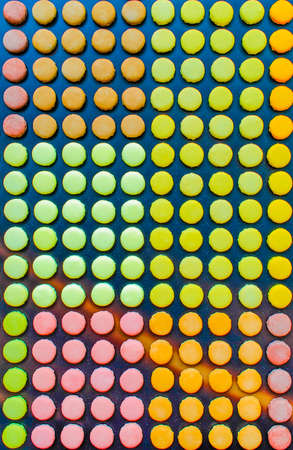 multicolored macarons assortment, arranged in rows, isolated on white background