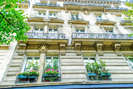 View on narrow cobbled street among traditional parisian buildings in Paris, Franceのeditorial素材