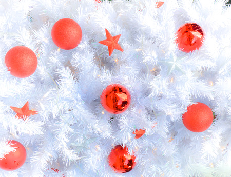 Snow white christmas tree with decoration in redの写真素材
