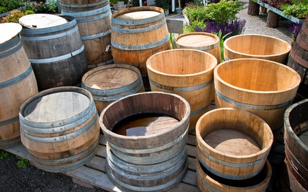 Some wooden barrels standing outside