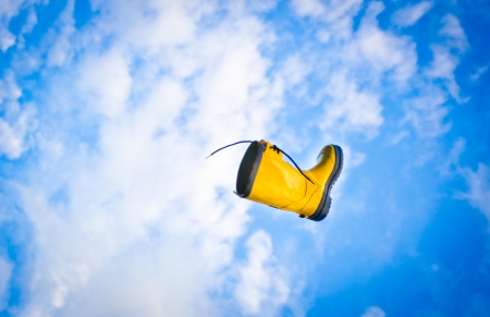 A flying boot in the blue skyの写真素材