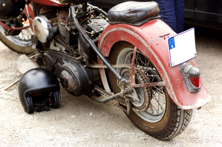 The backwheel of an old red motorcycleの写真素材