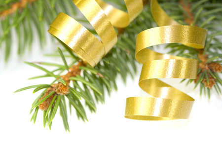 Gold curly ribbon on christmas treeの写真素材