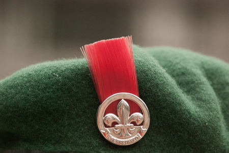 Red badge on beret of boy scout, Hong Kong, Chinaの写真素材