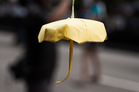 Origami yellow umbrella decoration,  a street blocking demonstration in 2014, Mong Kok, Hong Kong, Chinaの写真素材