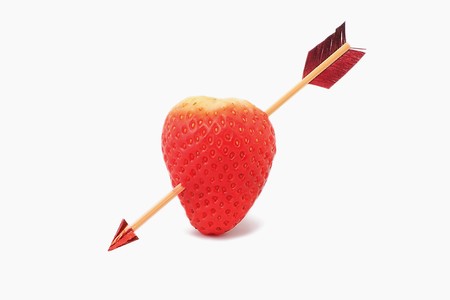 pierced heart on white backgroundの写真素材