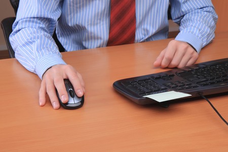 Businessman at office working at his workplace.の写真素材