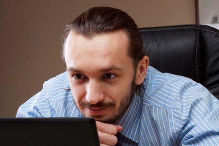 Young successful business man working at officeの写真素材