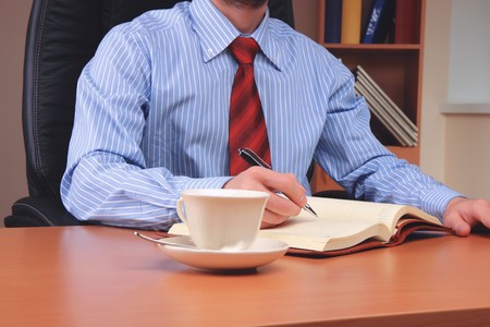 Businessman at office working at his workplace.の写真素材