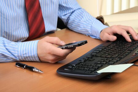 Businessman at office working at his workplace.の写真素材