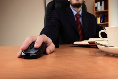 Businessman at office working at his workplace.の写真素材