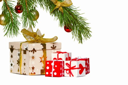 Boxes with gifts under a christmas fur-treeの写真素材
