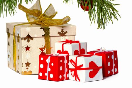 Boxes with gifts under a christmas fur-treeの写真素材