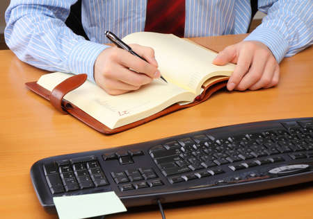 Businessman at office working at his workplace.の写真素材