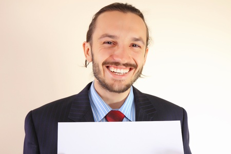 Business man with an empty white cardの写真素材