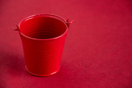 small red food bucket on a red background, stylish and modern