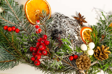 Christmas and New Year card, composition, spruce, cones, berries on a white background. Flat lay,...