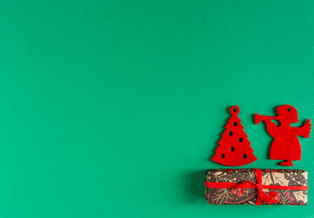childrens Christmas, New Year card - red felt toys and gifts on a green background. Flat lay, copy space, top viewの写真素材