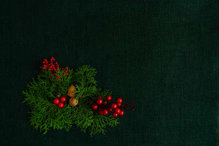 Beautiful New Year and Christmas composition on a background of green burlap, stylish. Flat lay,...