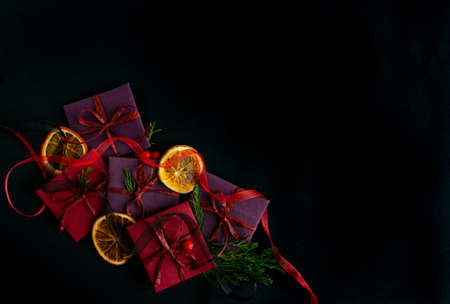 beautiful bright Christmas and New Year composition of gifts on a black background. Flat lay, copy space, top viewの写真素材