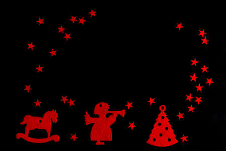 bright Christmas and New Year composition of red toys on a black background, postcard, Flat lay, copy space, top viewの写真素材